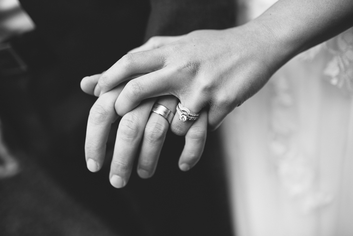 bride and groom with their wedding rings