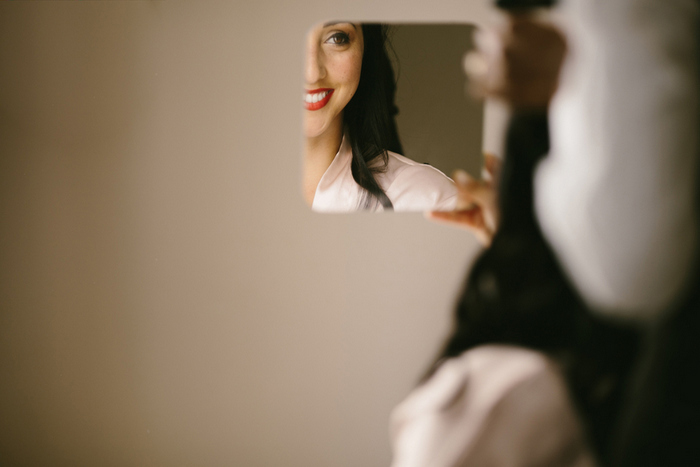 bride looking in mirror