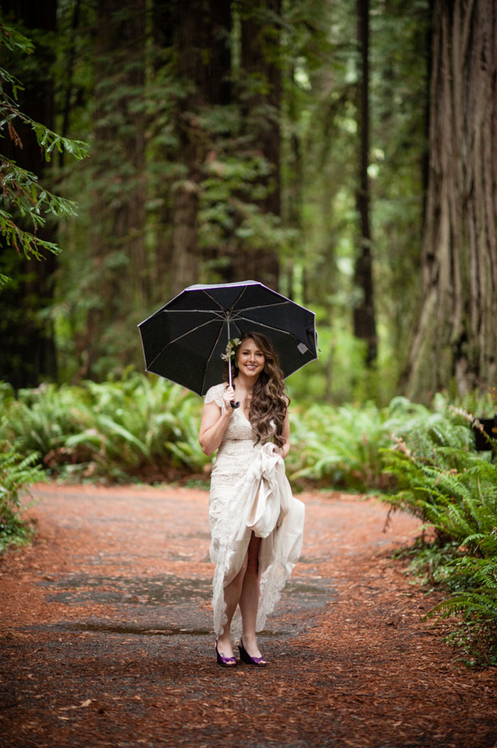 bride in the woods with umbrella