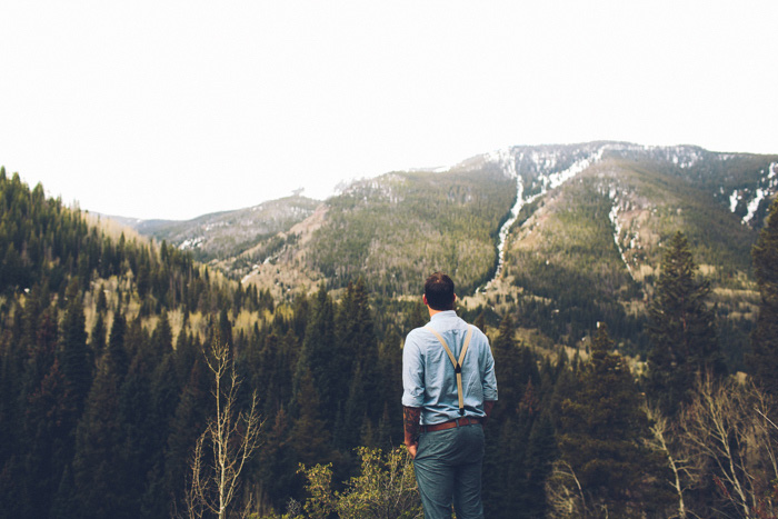 groom overlooking Colorado wilderness